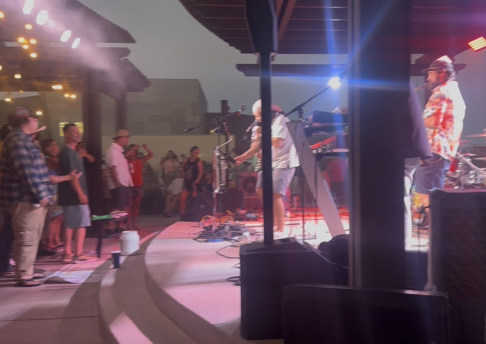 Band Mesozoic performing under purple and blue lighting with mist